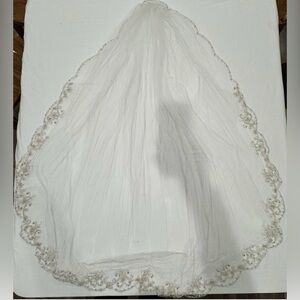 Elegant White Bridal Veil with beaded trim.